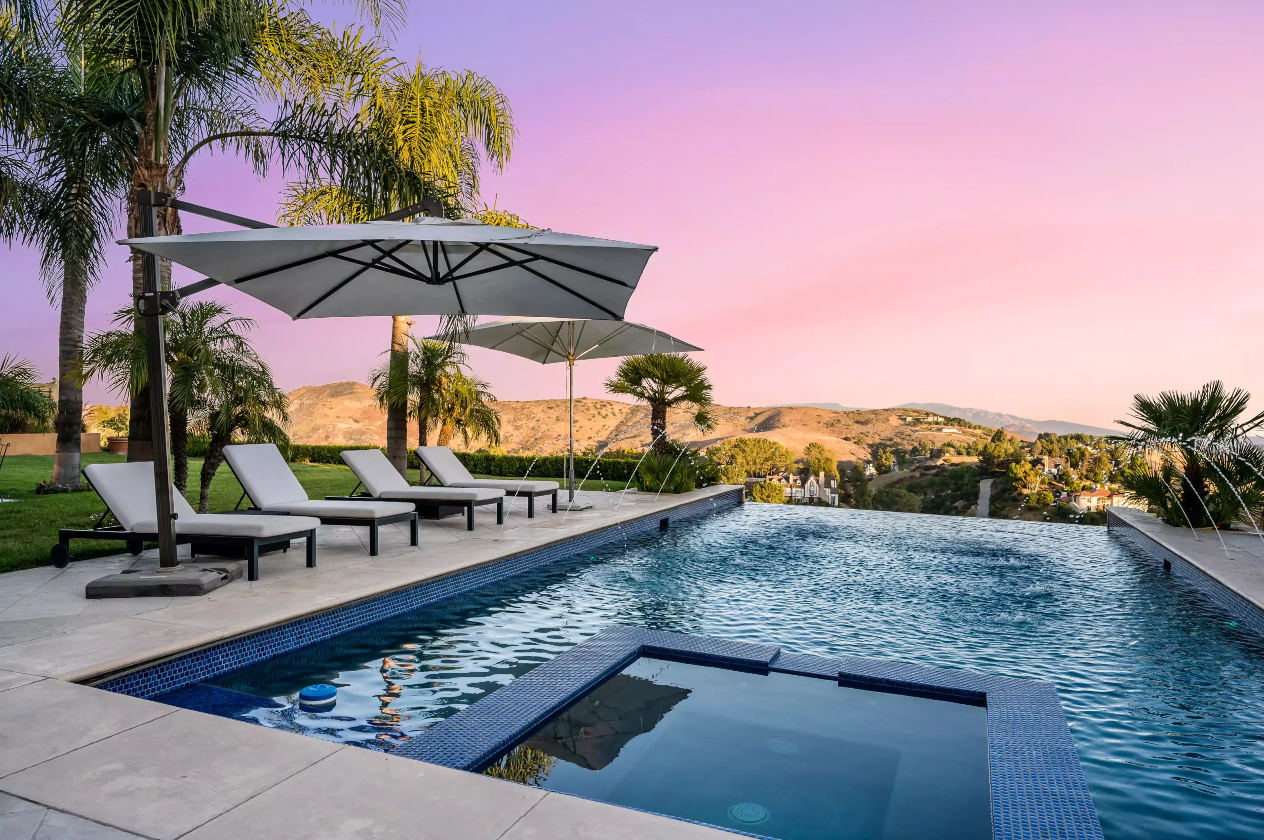 a-beautiful-pool-at-sunset-with-loungers-and-umbre-2024-05-10-17-13-16-utc